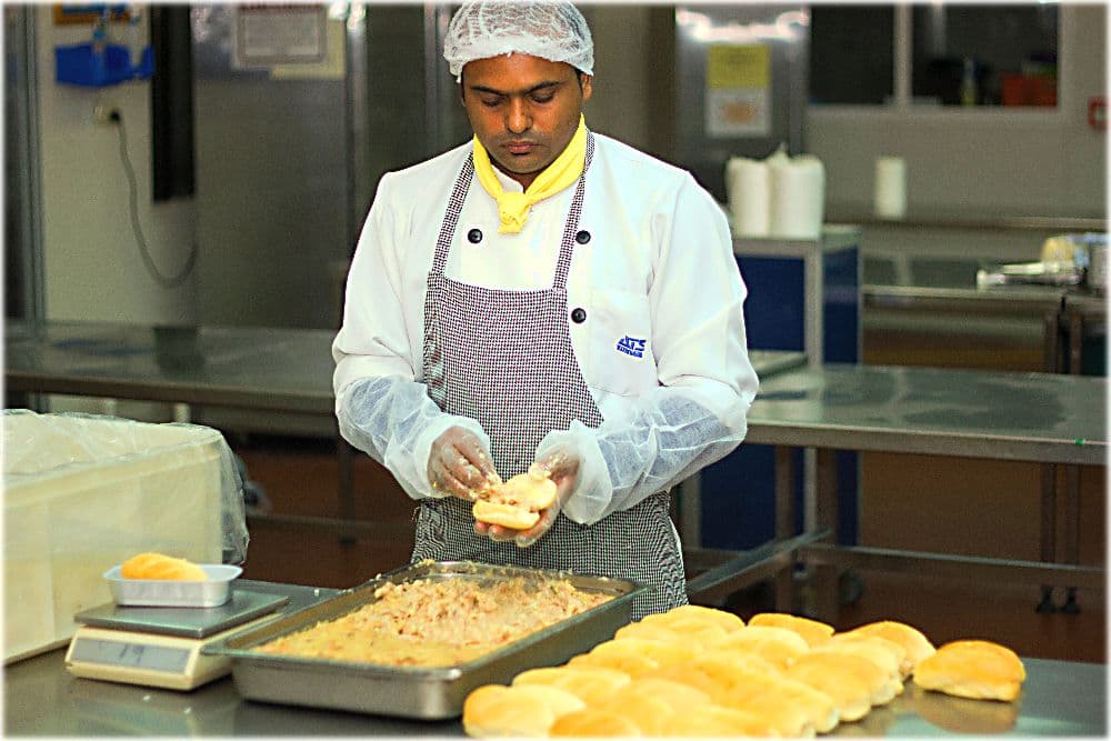 Professional kitchen preparing inflight catering meals